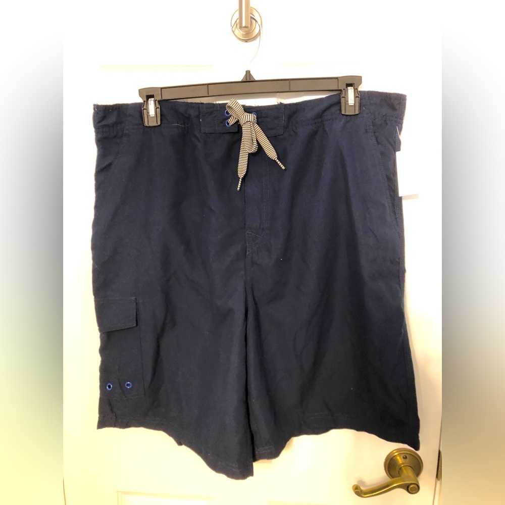 Men’s Swim trunks.  Size XXL. NWT. Navy blue. Side pocket and lined
